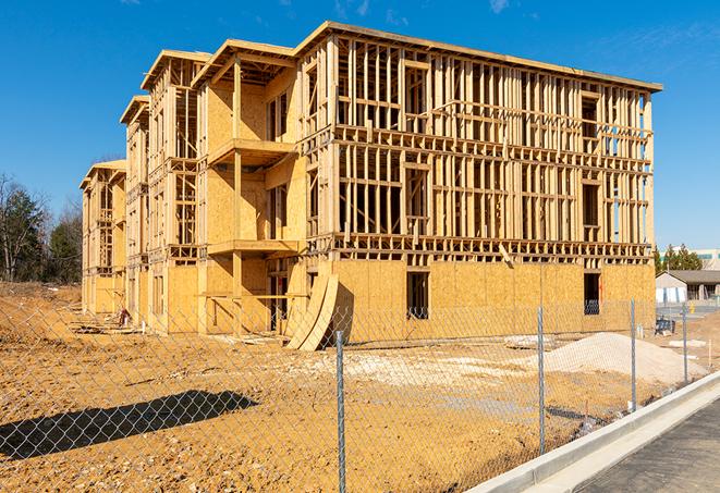 a job site enclosed by temporary chain link fences, ensuring safety for workers and pedestrians in Cypress CA